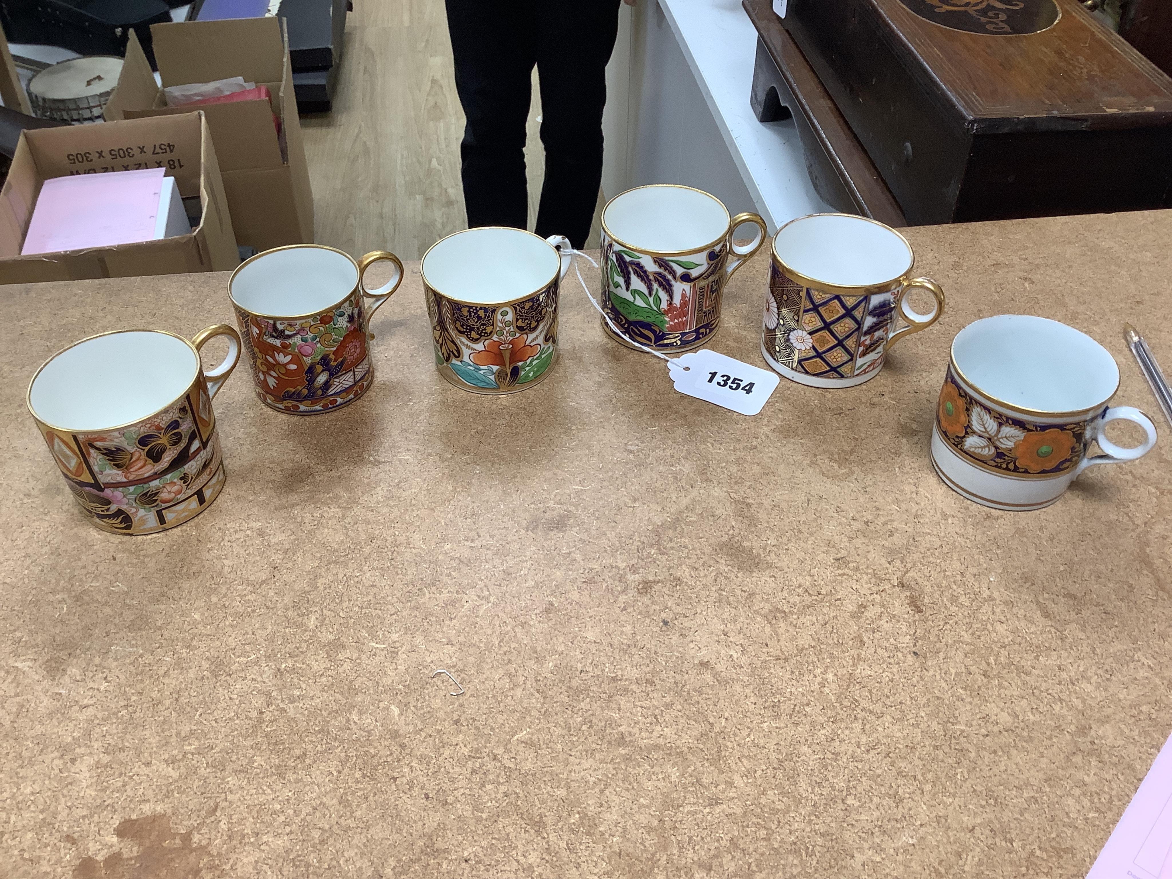 Twelve mixed 1800-1820 English porcelain Imari patterned coffee cans